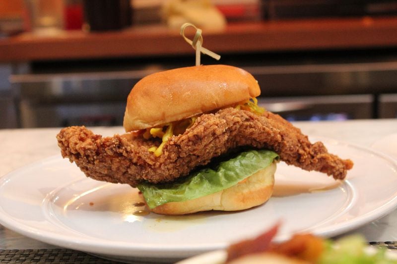 Richards’ Southern Fried’s catfish sandwich is minimally dressed with lettuce and chow chow. CONTRIBUTED BY TODD RICHARDS