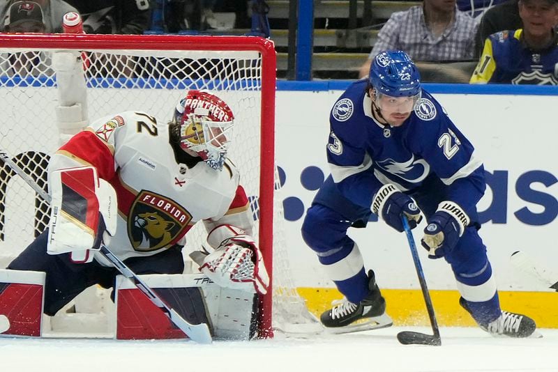 Tampa Bay Lightning center Michael Eyssimont (23) tries to wrap a shot past Florida Panthers goaltender Sergei Bobrovsky (72) during the first period in Game 3 of an NHL hockey Stanley Cup first-round playoff series, Thursday, April 25, 2024, in Tampa, Fla. (AP Photo/Chris O'Meara)