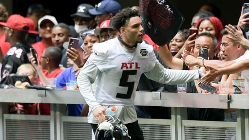 Wide receiver Drake London (5) interacts with fans Friday, June 3, 2022 at Mercedes-Benz Stadium. (Daniel Varnado/For the Atlanta Journal-Constitution)