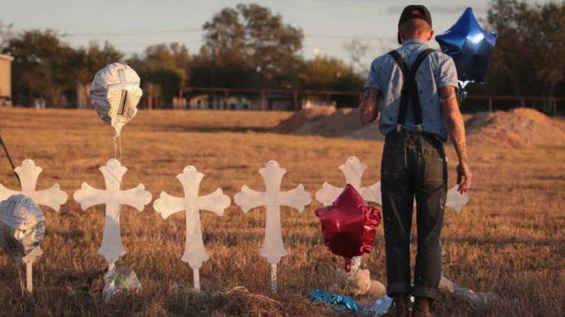 Derrick Bernaden of San Antonio, Texas visits a memorial where 26 crosses stand in a field on the edge of town to honor the 26 victims killed at the First Baptist Church of Sutherland Springs. (Getty Images)