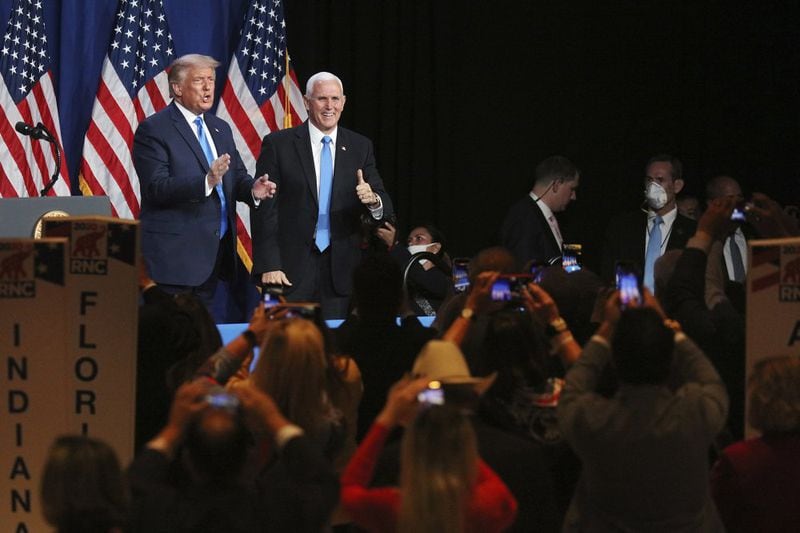 President Donald Trump and Vice President Mike Pence give a thumbs up after speaking during the first day of the Republican National Convention. (Travis Dove/The New York Times via AP, Pool)