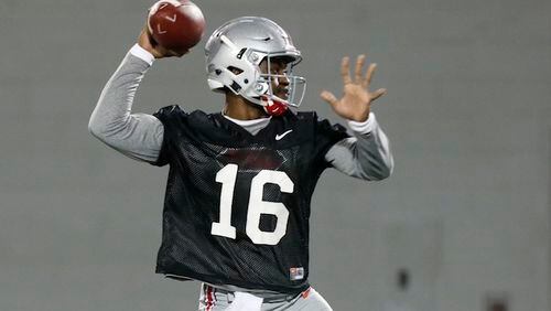 FILE - In this March 7, 2017, file photo, Ohio State quarterback J.T. Barrett runs a drill during an NCAA college football practice  in Columbus, Ohio. In many conferences, the Penn State would be predicted to repeat as Big Ten champions. Not in the Big Ten East, where Ohio State is loaded with as much talent as ever and motivated to atone for an embarrassing finish to 2016. (AP Photo/Jay LaPrete)