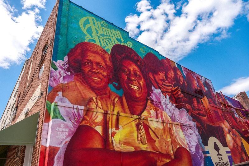 Unveiled in 2022, this mural painted by artist Steven Teller on the side of H&H depicts Mama Inez Hill, Mama Louise Hudson (middle) and the Allman Brothers Band. Courtesy of Jesse Horton