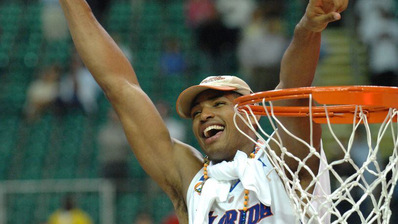 Florida's Al Horford celebrates after cutting part of the net after his team's victory in the NCAA final at the Georgia Dome on Aopril 2, 2007. (Rich Addicks / AJC file photo)