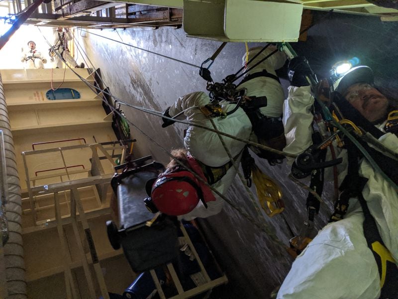 Response crews repel into the hull of Golden Ray and clear a path for oil spill equipment to safely remove oil from the steering gear room, St. Simons Sound, Georgia, Nov. 5, 2019. The complex pollution recovery and mitigation operations in a ship of this magnitude demand methodical planning and meticulous execution. 