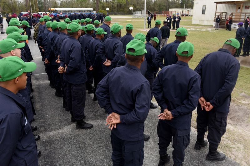 Cadets at the Fort Stewart Youth Challenge Academy stand in formation during a campus tour in February 2020. An AJC investigation in 2020 found the state-run boot camp’s adult platoon instructors — known as cadre — physically abused teenage cadets and sexually harassed female staff. The YCA program offers a quasi-military experience for teens, age 16 to 18, dividing them into platoons. The program's Fort Gordon camp made news in October 2022 when a massive brawl between different platoons caused leaders to shut down the class  and send the cadets home.  RYON HORNE / RHORNE@AJC.COM