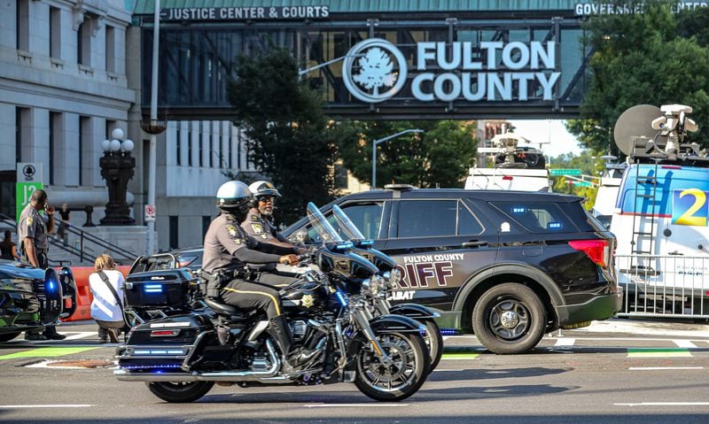 On Monday, Aug. 14, 2023, Fulton County Sheriff's cruisers and deputies on motorcycles were blocking the entrances to Pryor Street in the block in front of the Fulton County courthouse entrance where the case against former president, Donald Trump and others were presented before the grand jury. (John Spink/The Atlanta Journal-Constitution)