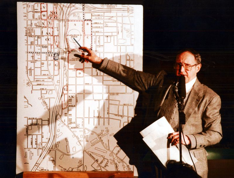 Leon Eplan was in charge of Olympics planning in 1993. Here, he was explaining where the city proposed to locate 10,011 stadium parking spaces. (Frank Niemeir/AJC file)