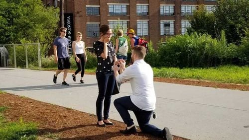 Peyton Momberger and Taylor Koshak got engaged on the Atlanta Beltline, with the help of Tiny Doors ATL.