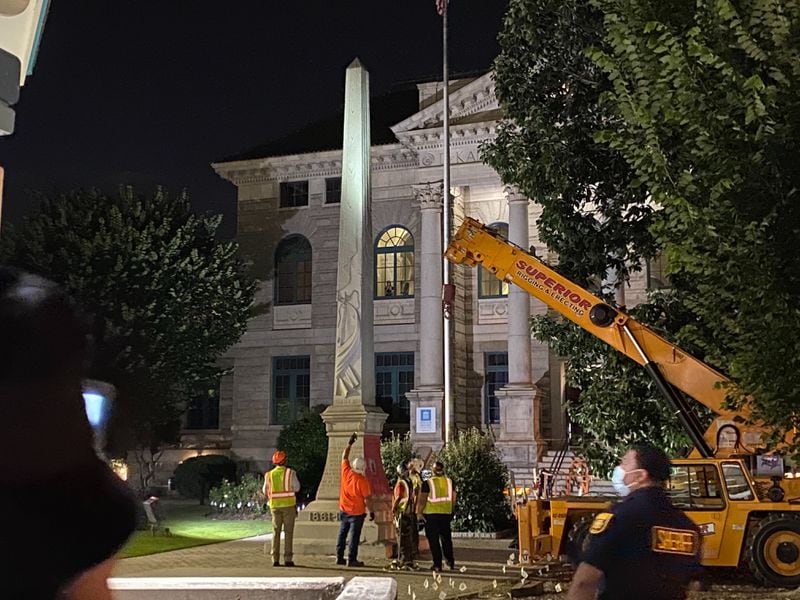 A 30-foot obelisk Confederate moment, which has stood for 112 years, was taken down in downtown Decatur Square in 2020. The monument was erected in 1908 by the United Daughters of the Confederacy. Photos by Amanda Coyne / AJC