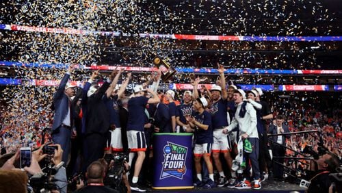 MINNEAPOLIS, MINNESOTA - APRIL 08: The Virginia Cavaliers celebrate with the trophy after their 85-77 win over the Texas Tech Red Raiders during the 2019 NCAA men's Final Four National Championship game at U.S. Bank Stadium on April 08, 2019 in Minneapolis, Minnesota. (Photo by Tom Pennington/Getty Images)