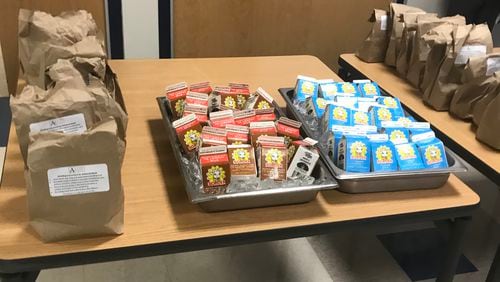 Atlanta Public Schools is providing free bagged breakfast and lunch meals at 10 school buildings . VANESSA McCRAY/AJC