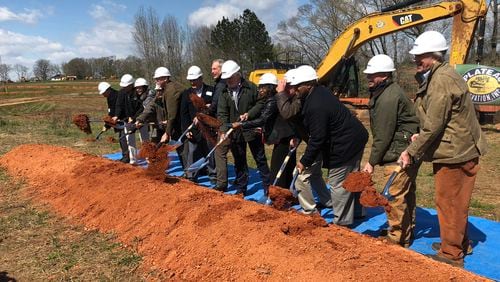 Officials with PNK Group, Henry County and others help break ground on 1.1 million-square-foot logistics center in McDonough in March. LEON STAFFORD/AJC