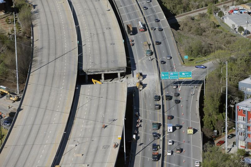Aerial photo last Friday shows the portion of I-85 that collapsed after Thursday’s fire. BOB ANDRES / BANDRES@AJC.COM