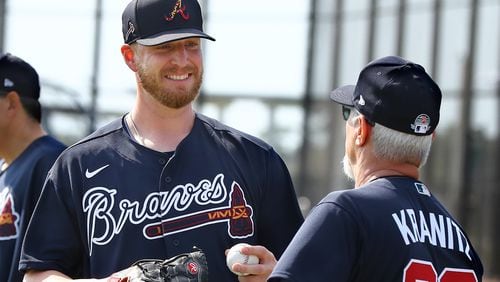 Braves reliever Will Smith, who joined Atlanta this offseason,  confers with pitching coach Rick Kranitz during the first workout oft spring Thursday, Feb. 13, 2020, at CoolToday Park in North Port, Fla.