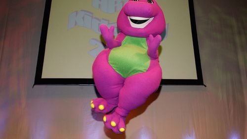 HOLLYWOOD - AUGUST 18: Barney the dinosaur performs during the Hollywood Radio and Television Society's 10th Annual Kids Day 2004 show on August 18, 2004 at Hollywood and Highland's grand ballroom in Hollywood, California. (Photo by Vince Bucci/Getty Images)