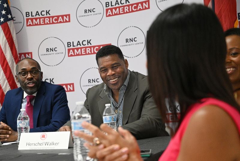 Republican U.S. Senate candidate Herschel Walker has criticized roughly $300 billion in new taxes on certain corporate stock repurchases and big corporations that were part of a package of climate change, health care and tax measures that President Joe Biden just signed into law. “Like, do they not know things trickle down?” Walker said of the Democratics promoters of the law. “They don’t understand budgets. They don’t understand finance.” (Hyosub Shin / Hyosub.Shin@ajc.com)