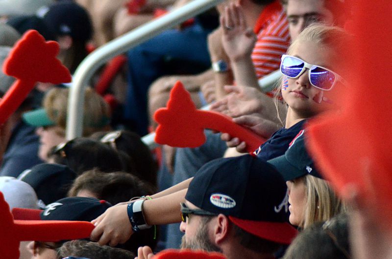 A young Atlanta Braves fan does the "Tomahawk Chop" on Monday, Oct. 8, 2018 at SunTrust Park. The Braves faced the Dodgers in Game Four of the NLDS. 