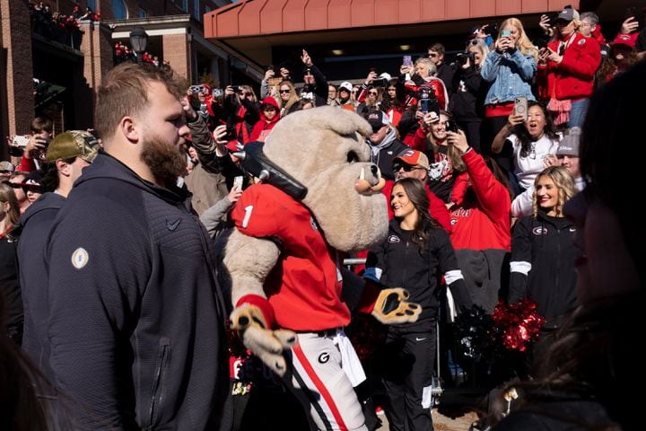 Hairy Dawg passes fans on the Dawg Walk before the UGA football celebration Saturday, Jan. 14, 2023 in Athens. Ben Gray for the Atlanta Journal-Constitution