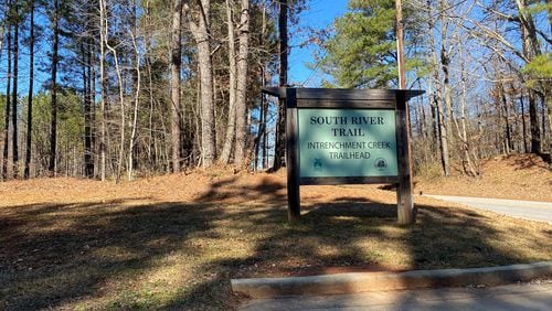 A sign outside the existing trailhead for the South River Trail at Intrenchment Creek Park, near Bouldercrest Road in southwest DeKalb County. TYLER ESTEP / TYLER.ESTEP@AJC.COM