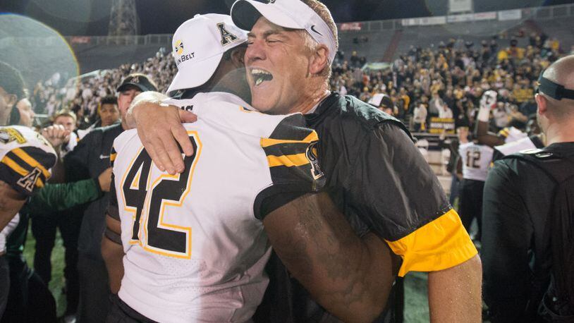 MOBILE, AL - DECEMBER 23: Defensive coordinator Nate Woody of the Appalachian State Mountaineers celebrates with defensive lineman Tee Sims #42 of the Appalachian State Mountaineers after defeating the Toledo Rockets on December 23, 2017 at Ladd-Peebles Stadium in Mobile, Alabama. (Photo by Michael Chang/Getty Images)