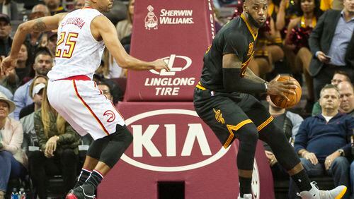Cleveland Cavaliers’ LeBron James, right, spins towards the basket as Atlanta Hawks’ Thabo Sefolosha (25) defends during the second half of an NBA basketball game in Cleveland, Tuesday, Nov. 8, 2016. The Hawks won 110-106. (AP Photo/Phil Long)