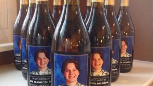 An Ohio couple gave teachers  wine for Christmas with homemade labels featuring thier son’s face, saying they needed something a little stonger than a mug for coffee.