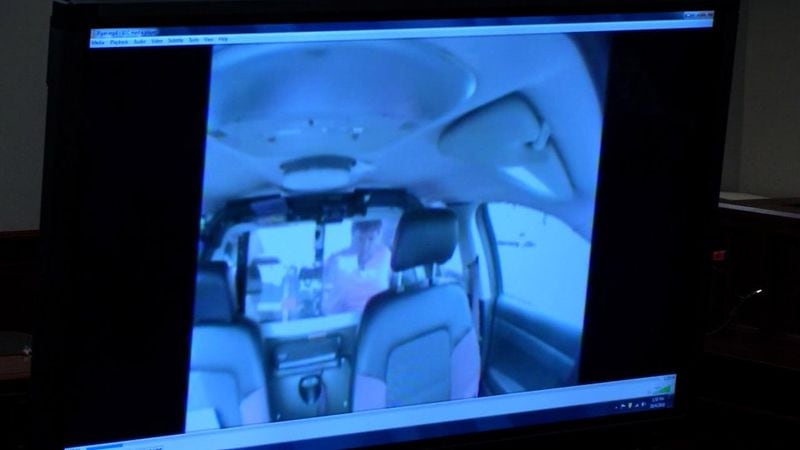 This video of Justin Ross Harris in the back of a patrol car was referenced during the cross examination of Cobb County lead detective Phil Stoddard during Harris' murder trial at the Glynn County Courthouse in Brunswick, Ga., on Monday, Oct. 24, 2016. Stoddard said that he didn't see any tears on Harris' face in the video. (screen capture via WSB-TV)