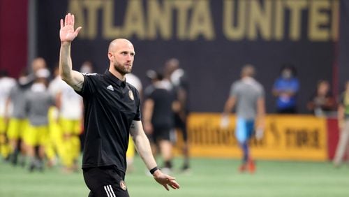 Atlanta United interim coach Rob Valentino waves to the crowd after their 1-0 loss to the Columbus Crew Saturday, July 24, 2021, at Mercedes Benz Stadium in Atlanta. (Jason Getz/For the AJC)