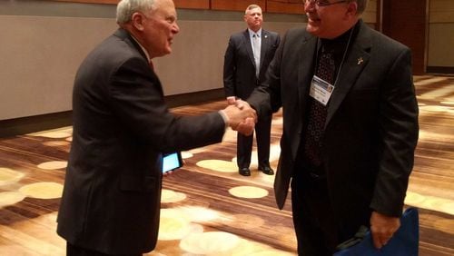 Gov. Nathan Deal and Georgia School Superintendent Richard Woods at a happier interaction than their recent exchange over the state's accountability plan. (AJC File)