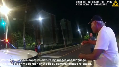 Body camera footage released shows the moments leading up to Johnny Hollman's death Aug. 10 following a minor car crash in southwest Atlanta.