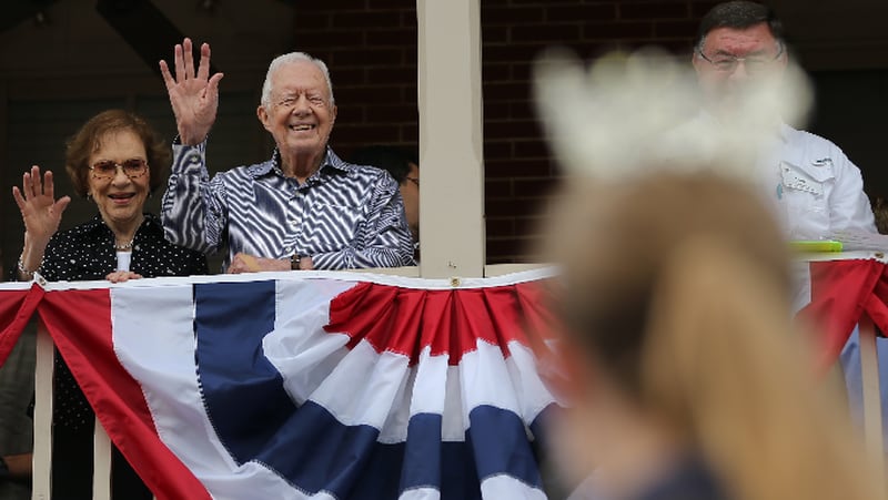 Former President Jimmy Carter and First Lady Rosalynn Carter wave to a beauty queen during the Peanut Festival on Saturday September 26, 2015 in Plains. Much of Plains is within the Jimmy Carter National Historic Site and Preservation District run by the National Park Service, which is making Carter an honorary national park ranger on Sunday. Ben Gray / bgray@ajc.com