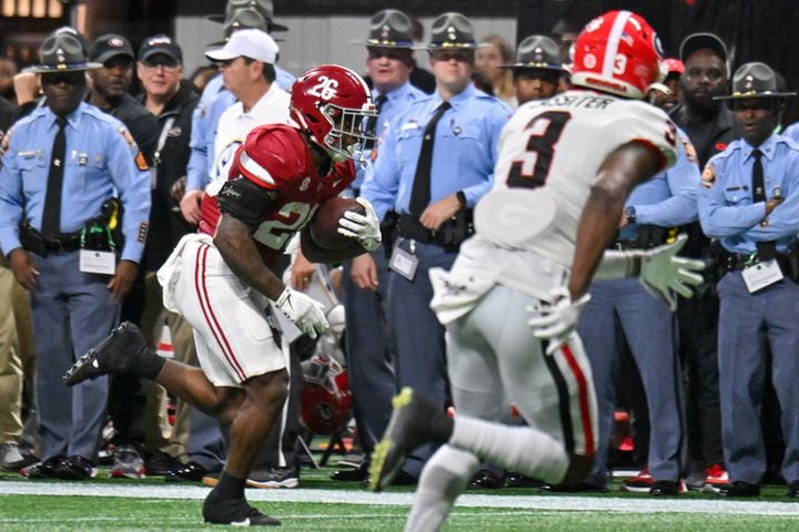 Alabama Crimson Tide running back Jam Miller (26) scores a touchdown on a 28 yard pass against the Georgia Bulldogs during the first half of the SEC Championship football game at the Mercedes-Benz Stadium in Atlanta, on Saturday, December 2, 2023. (Hyosub Shin / Hyosub.Shin@ajc.com)
