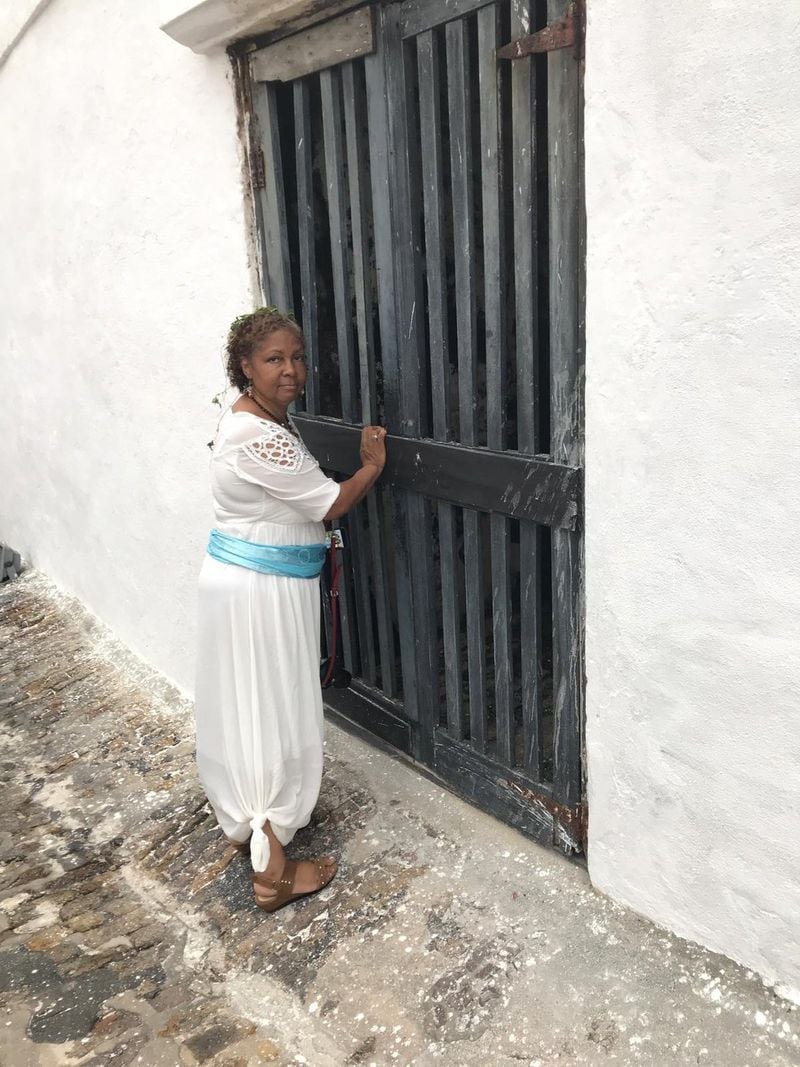 Debra Santos, outside of Elmina Castle in Ghana. “I didn’t know what to expect when I got to Elmina,” she said. “Nothing could prepare me for it.”