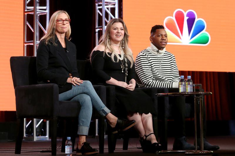  PASADENA, CA - JANUARY 09: (L-R) Executive producer Audrey Morrissey, singer/Coach Kelly Clarkson, and Season 12 winner Chris Blue of 'The Voice' speak onstage during the NBCUniversal portion of the 2018 Winter Television Critics Association Press Tour at The Langham Huntington, Pasadena on January 9, 2018 in Pasadena, California. (Photo by Frederick M. Brown/Getty Images)