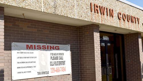 A banner with a faded picture of Tara Grinstead hangs outside the Irwin County Sheriff’s Office in Ocilla. (ALEXIS STEVENS/astevens@ajc.com)