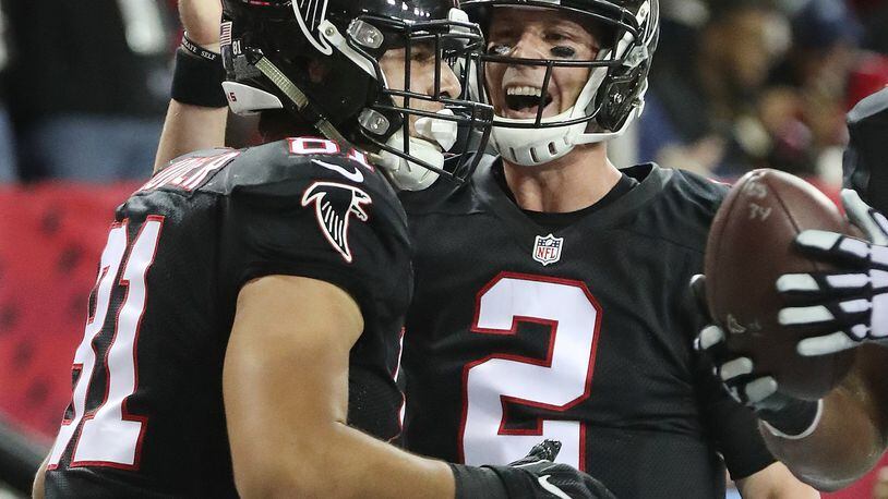 Falcons quarterback Matt Ryan celebrates his touchdown pass to tight end Austin Hooper for a 21-0 lead over the 49ers during the first quarter in NFL football game on Sunday, Dec. 18, 2016, in Atlanta. Curtis Compton/ccompton@ajc.com