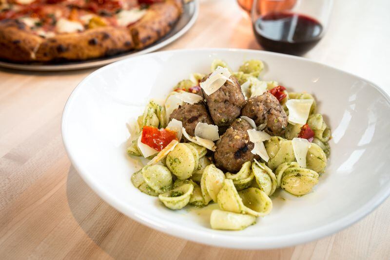 Pork Meatball Pesto pasta with calabrese peppers, herbed pecan bread crumbs, and grana padano. Photo credit- Mia Yakel.