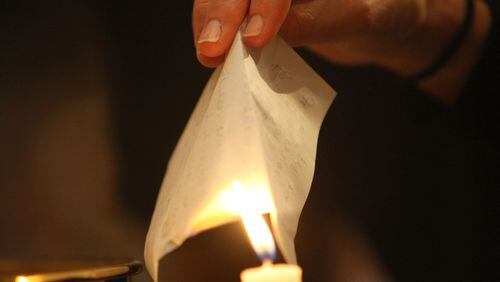 The New Year’s Eve burning bowl ceremony at Unity North Atlanta Church in Marietta is a chance to let go of what no longer serves a purpose in one’s life and to prepare for the new year. AJC FILE PHOTO