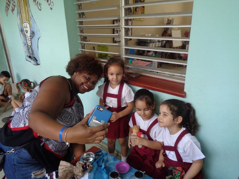 Spelman College grad Seana Deas engages children at an elementary school in Varadero, Cuba, during one of the school’s study trips. The HBCU hopes to increase the number of African-American teachers and thus slow the achievement gap of black students. CONTRIBUTED