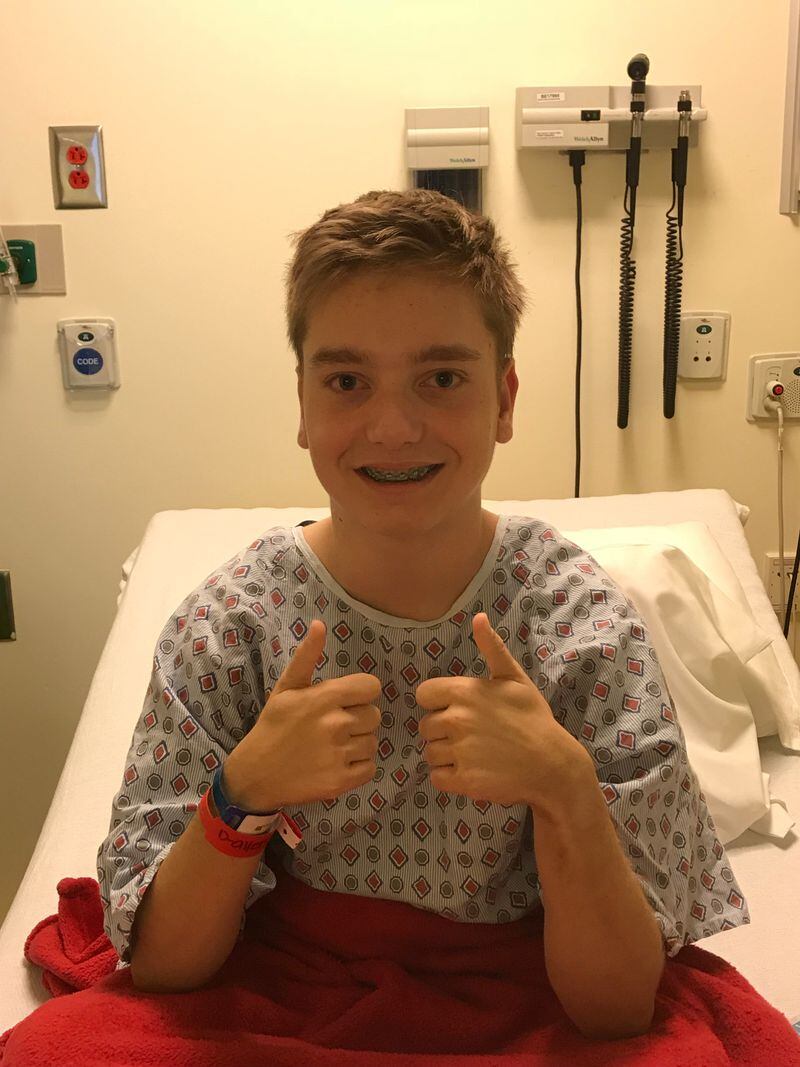 Kaden giving the thumbs up before surgery. CONTRIBUTED