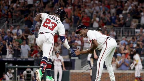 Braves center fielder Michael Harris (23) celebrates his solo home run with third base coach Ron Washington during the seventh inning against the St. Louis Cardinals at Truist Park on Thursday, July 7, 2022, in Atlanta. The Cardinals won 3-2. (Jason Getz / Jason.Getz@ajc.com)