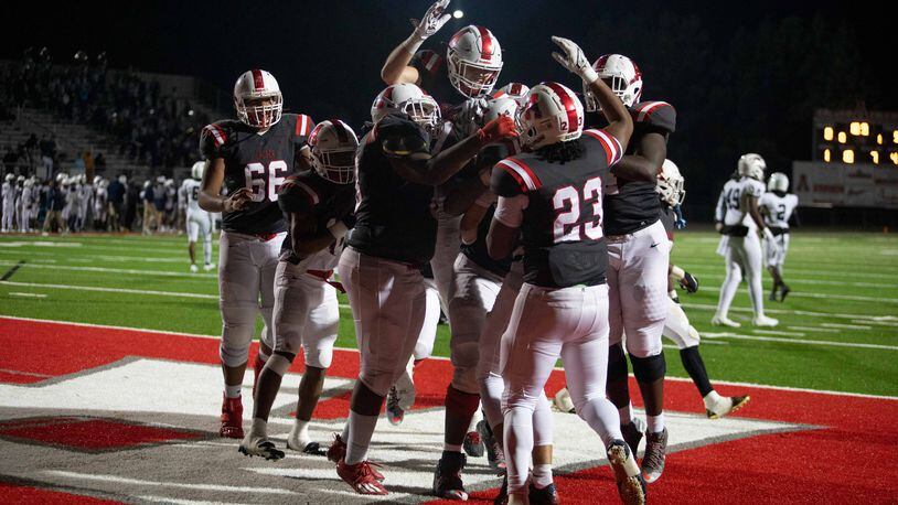 Archer players celebrate at a GHSA high school football game between Archer High School and Norcross High School in Lawrenceville, GA., on Friday, November 5, 2021. Archer won 9-0. (Photo/Jenn Finch)