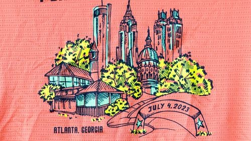 The Atlanta Journal-Constitution Peachtree Road Race 2023 t-shirt, shown at the Atlanta Track Club, Tuesday, June, 27, 2023. (Jason Getz / Jason.Getz@ajc.com)