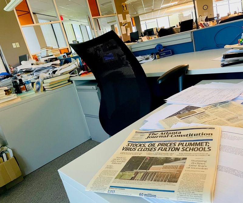 Sign of the times: A yellowing newspaper from March 2020 left on a desk in the AJC newsroom tells of the looming crisis. Photo by Bill Torpy