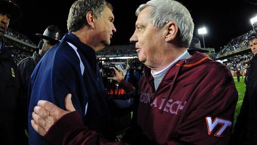 ATLANTA - NOVEMBER 10: Head Coach Frank Beamer of the Virginia Tech Hokies is congratulated by Head Coach Paul Johnson of the Georgia Tech Yellow Jackets after the game at Bobby Dodd Stadium on November 10, 2011 in Atlanta, Georgia. Photo by Scott Cunningham/Getty Images)