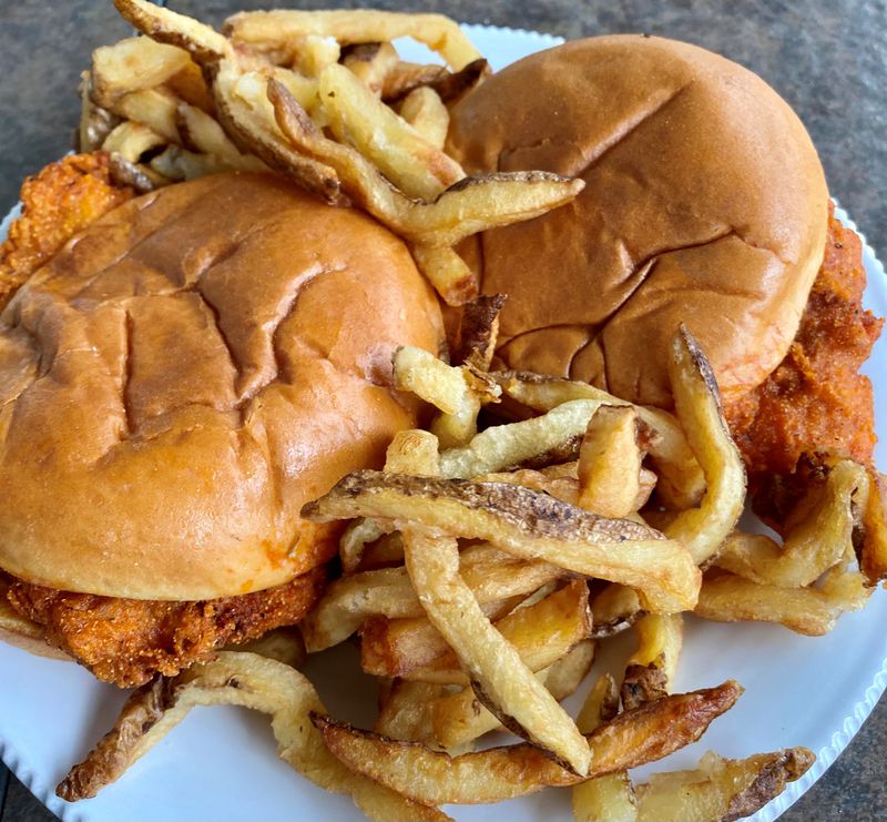 Shown here are two Nashville hot chicken sandwiches and fries from Farm Birds, a virtual chicken sandwich shop that is an offshoot of Farm Burger. Wendell Brock for The Atlanta Journal-Constitution