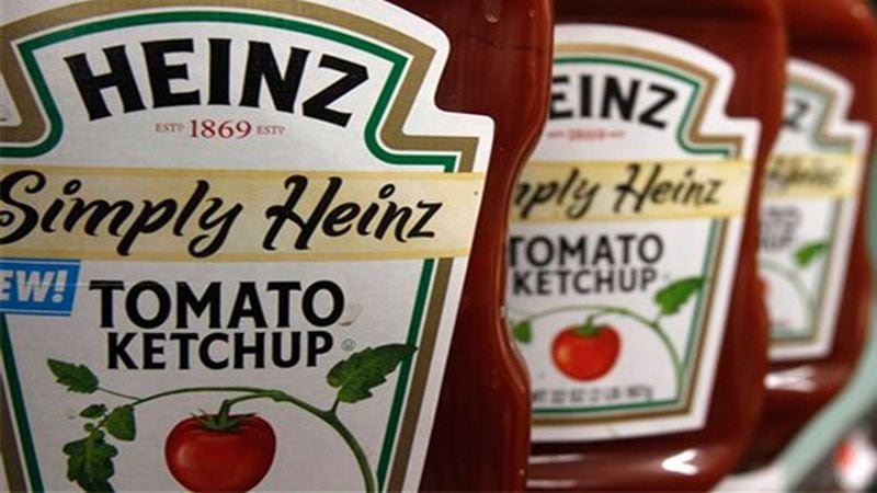FILE - This Wednesday, March 2, 2011, file photo, shows containers of Heinz ketchup on the shelf of a market, in Barre, Vt. H.J. Heinz Co. is buying Kraft Foods Group Inc., creating what the companies say will be the third-largest food and beverage company in North America, the companies announced Wednesday, March 25, 2015. (AP Photo/Toby Talbot, File)