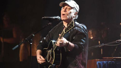 Singer Paul Simon performed four songs Saturday at a fundraiser near his Long Island home.