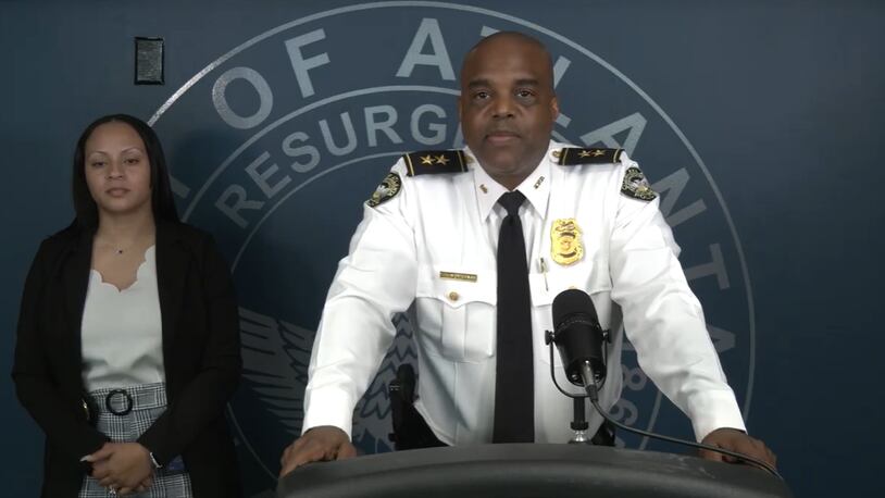 Atlanta police Deputy Chief Charles Hampton Jr. and Detective Desire Hulse ask the public for help in solving a triple homicide that happened Aug. 22, 2021.